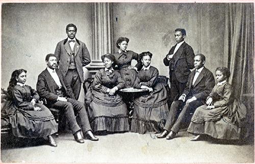 Black and white image of the original Jubilee Singers both seated and standing.